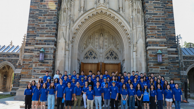 The incoming class of FinTech Students in front of the Duke Chapel
